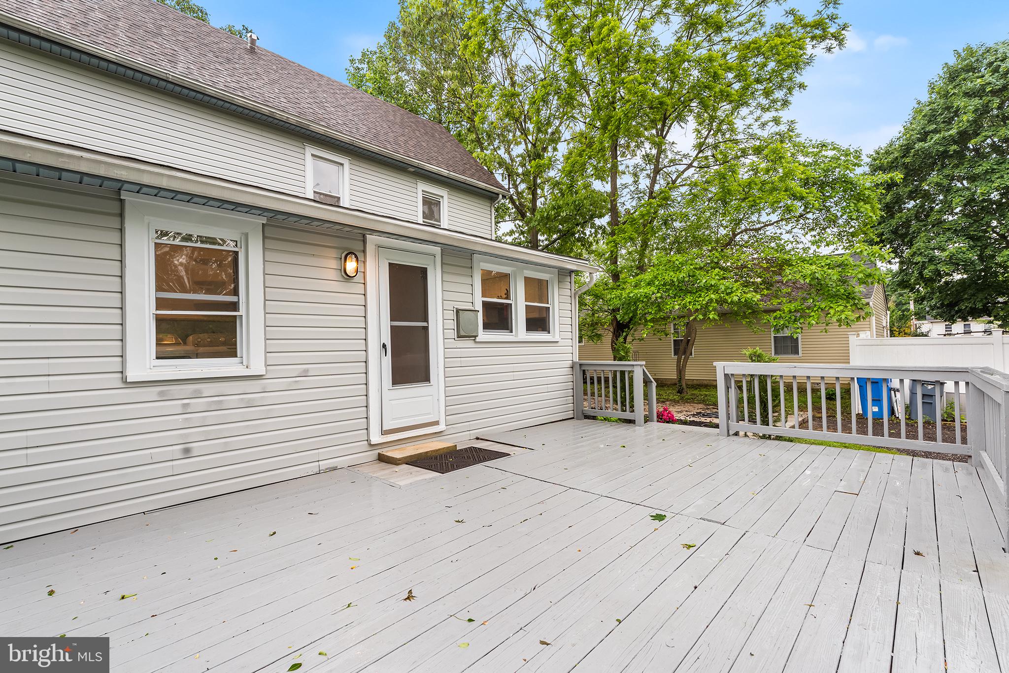 131 West Clinton Street Clayton, NJ 08312 - Photo 35 of 41 a view of a house with wooden deck