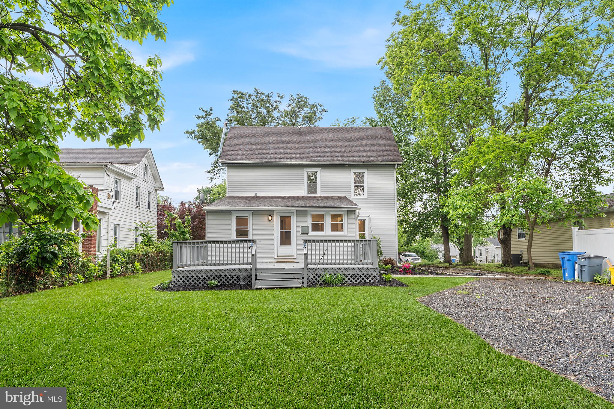 131 West Clinton Street Clayton, NJ 08312 - Photo 37 of 41 a view of house with a big yard and large trees