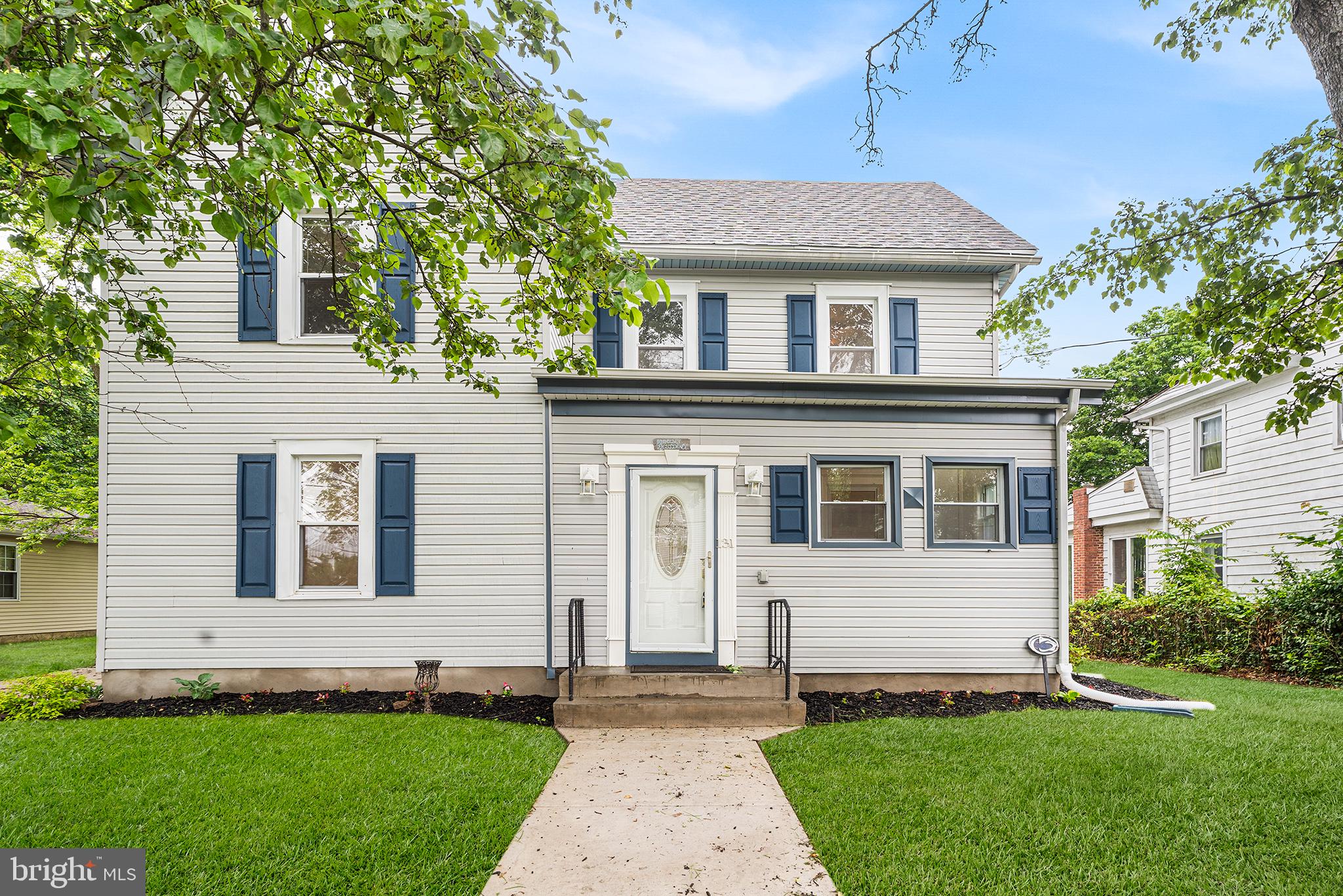 131 West Clinton Street Clayton, NJ 08312 - Photo 6 of 41 a front view of a house with a yard