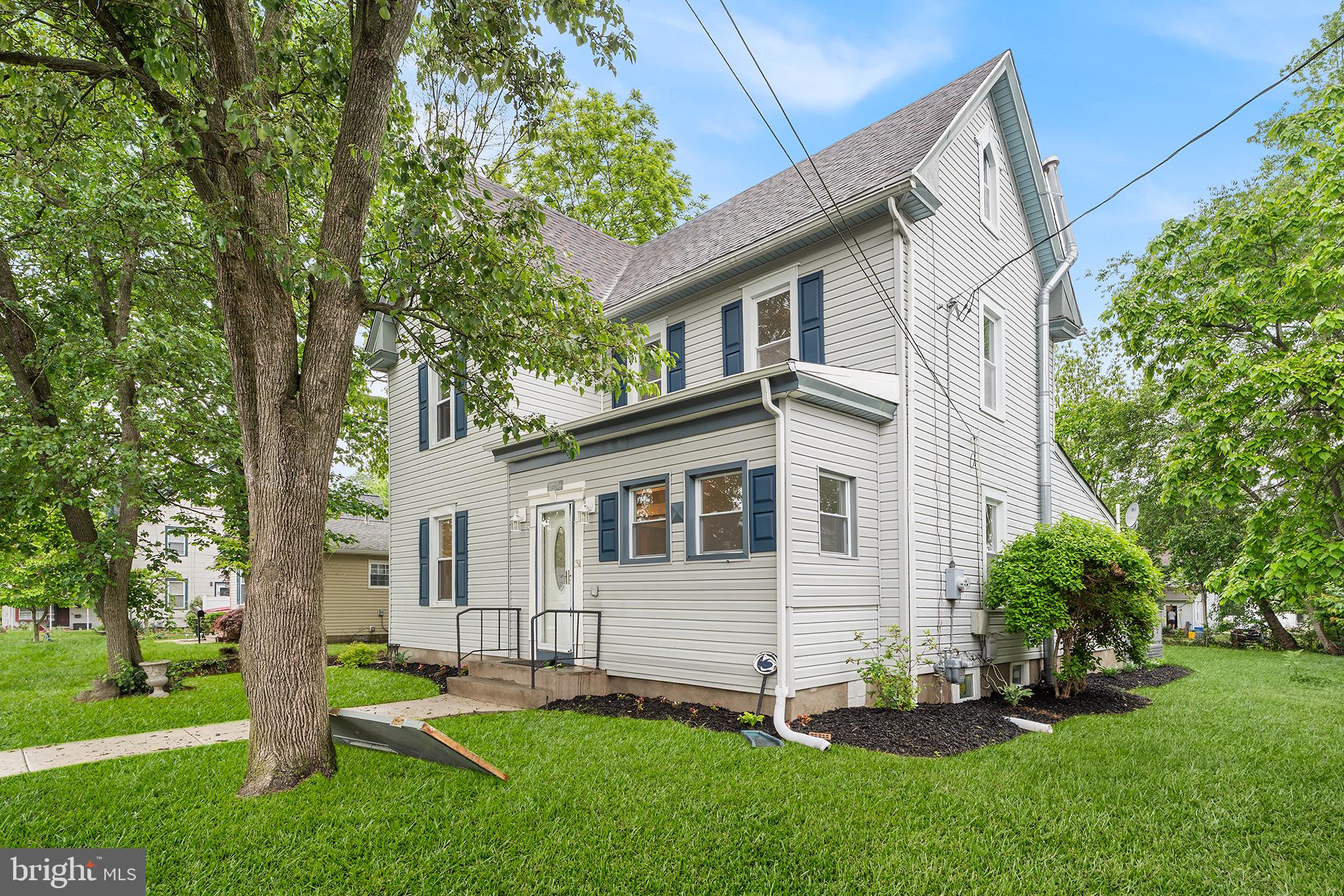 131 West Clinton Street Clayton, NJ 08312 - Photo 7 of 41 a view of backyard with a garden and plants