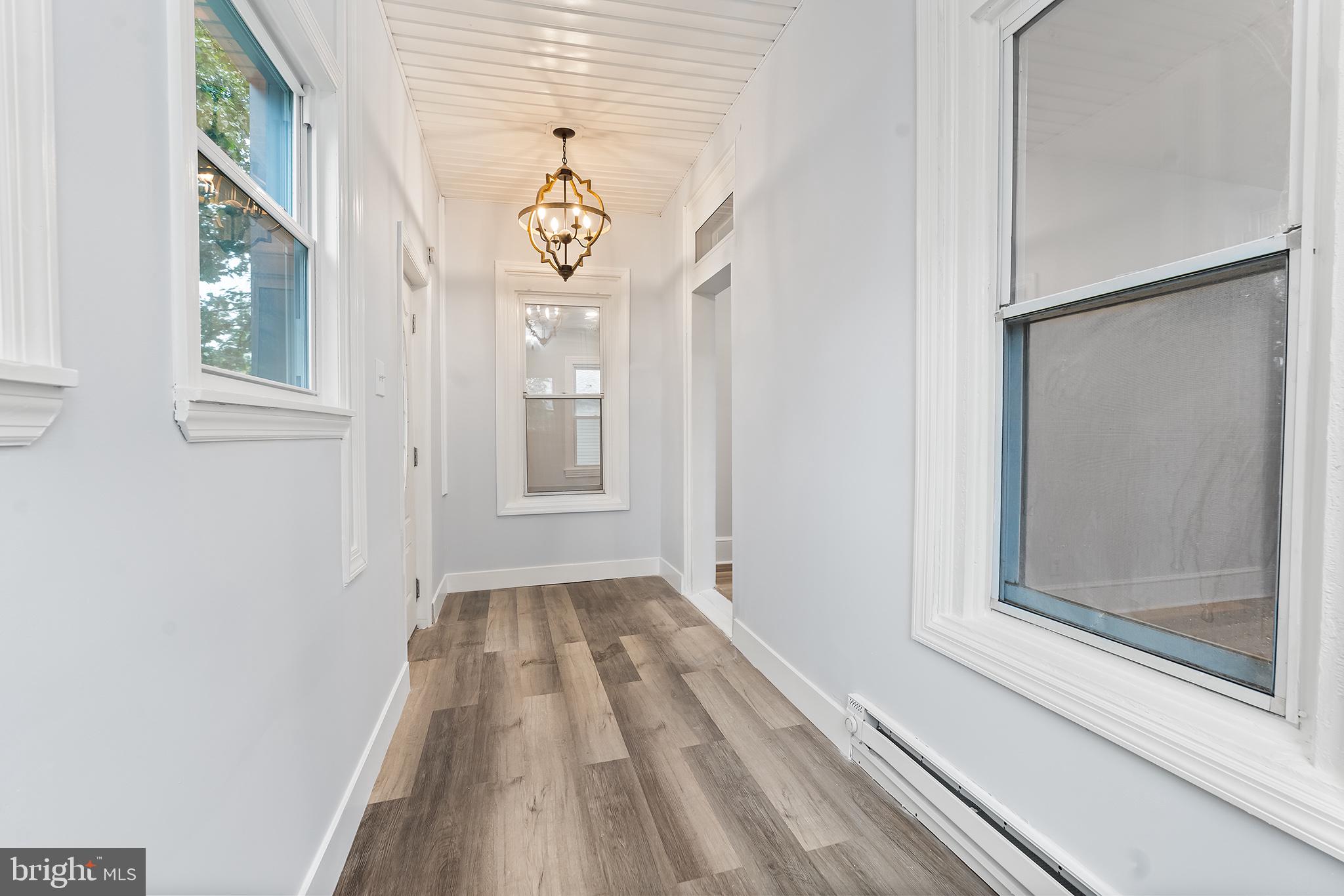 131 West Clinton Street Clayton, NJ 08312 - Photo 10 of 41 a view of a hallway with windows