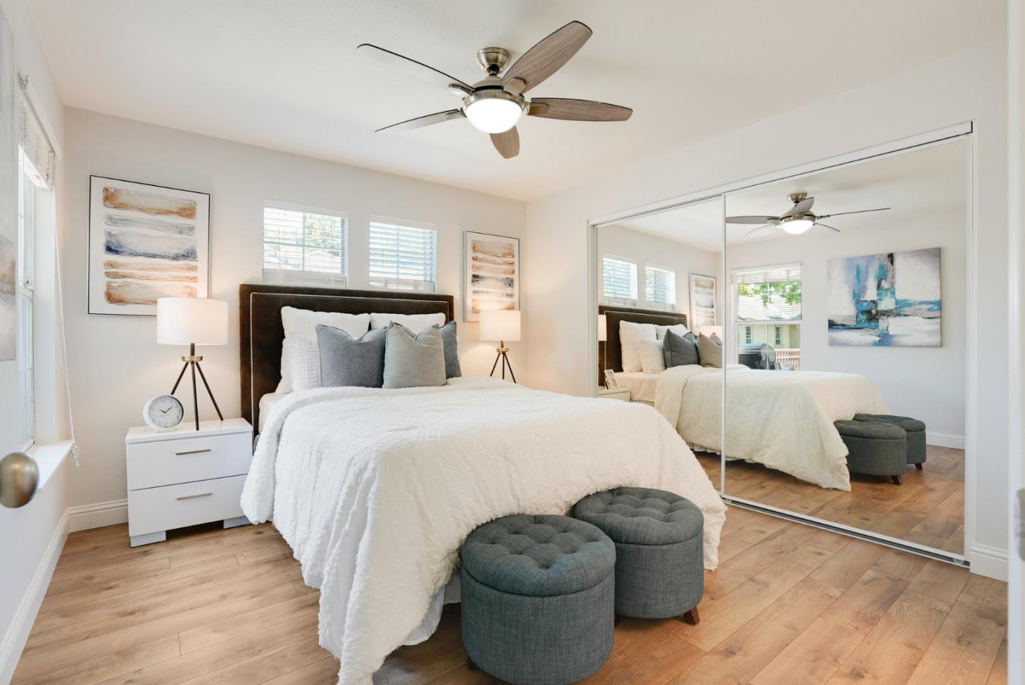 394 Oleander Drive San Jose, CA 95123 - Photo 13 of 27 a bedroom with a bed and a large window