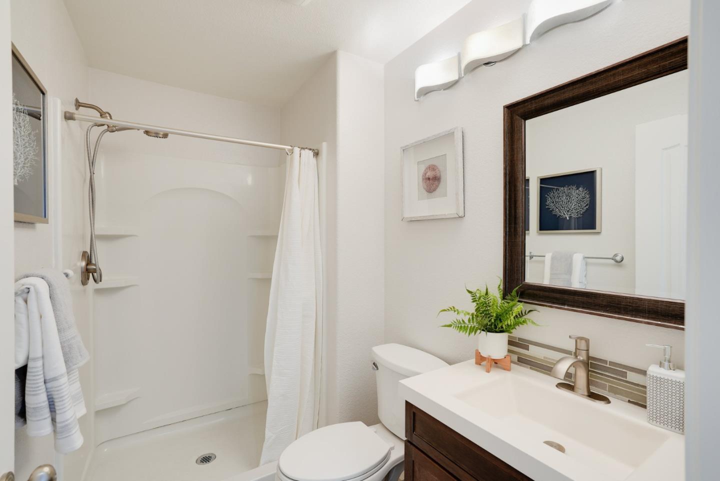394 Oleander Drive San Jose, CA 95123 - Photo 17 of 27 a bathroom with a sink toilet and shower