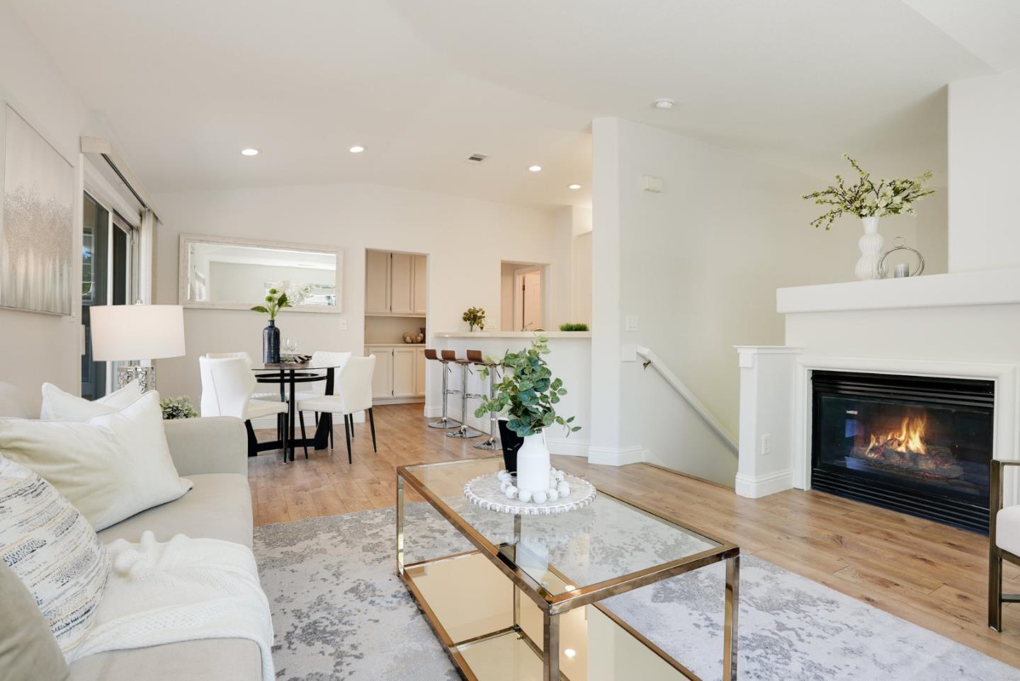 394 Oleander Drive San Jose, CA 95123 - Photo 6 of 27 a living room with furniture a fireplace and a table