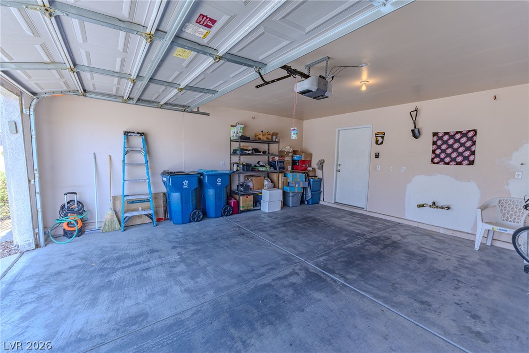 4994 Mascaro Drive Las Vegas, NV 89122 - Photo 26 of 30 A capacious garage offers ample storage and parking versatility for vehicles and equipment.