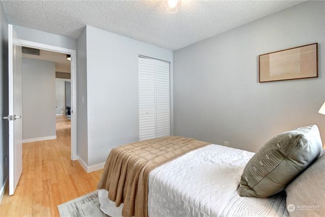 a bedroom with a bed and a couch