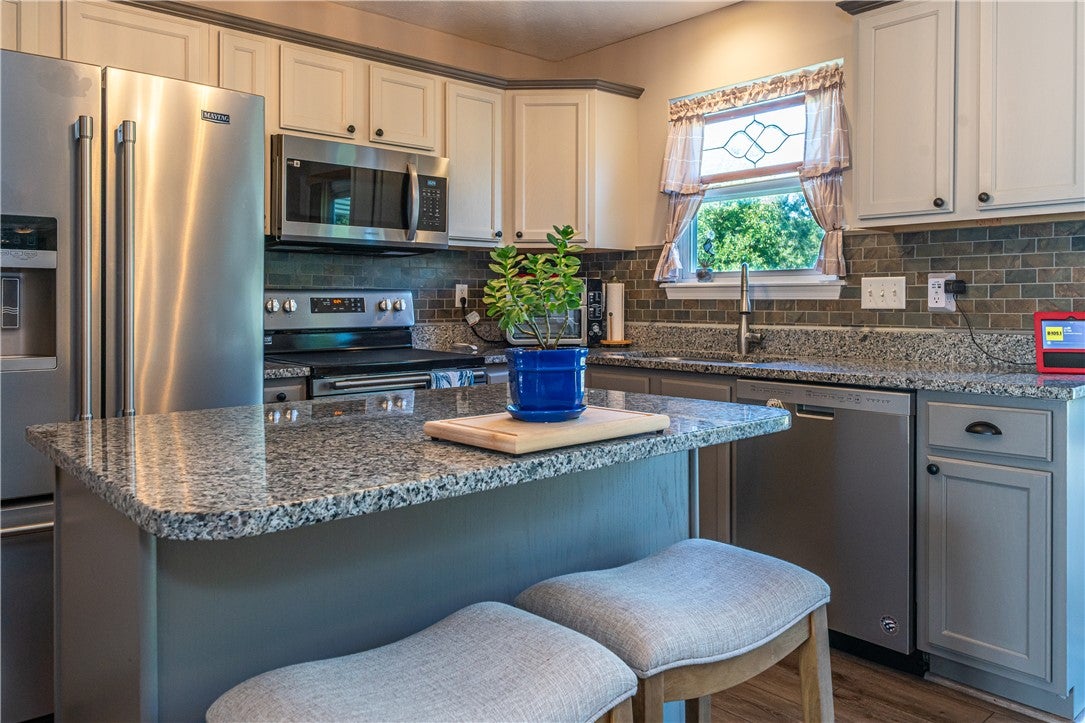 10765 Stone Ridge Way Harrison, OH 45030 - Photo 6 of 68 A well-appointed kitchen features ample counter space, modern appliances, and a convenient island for casual dining.