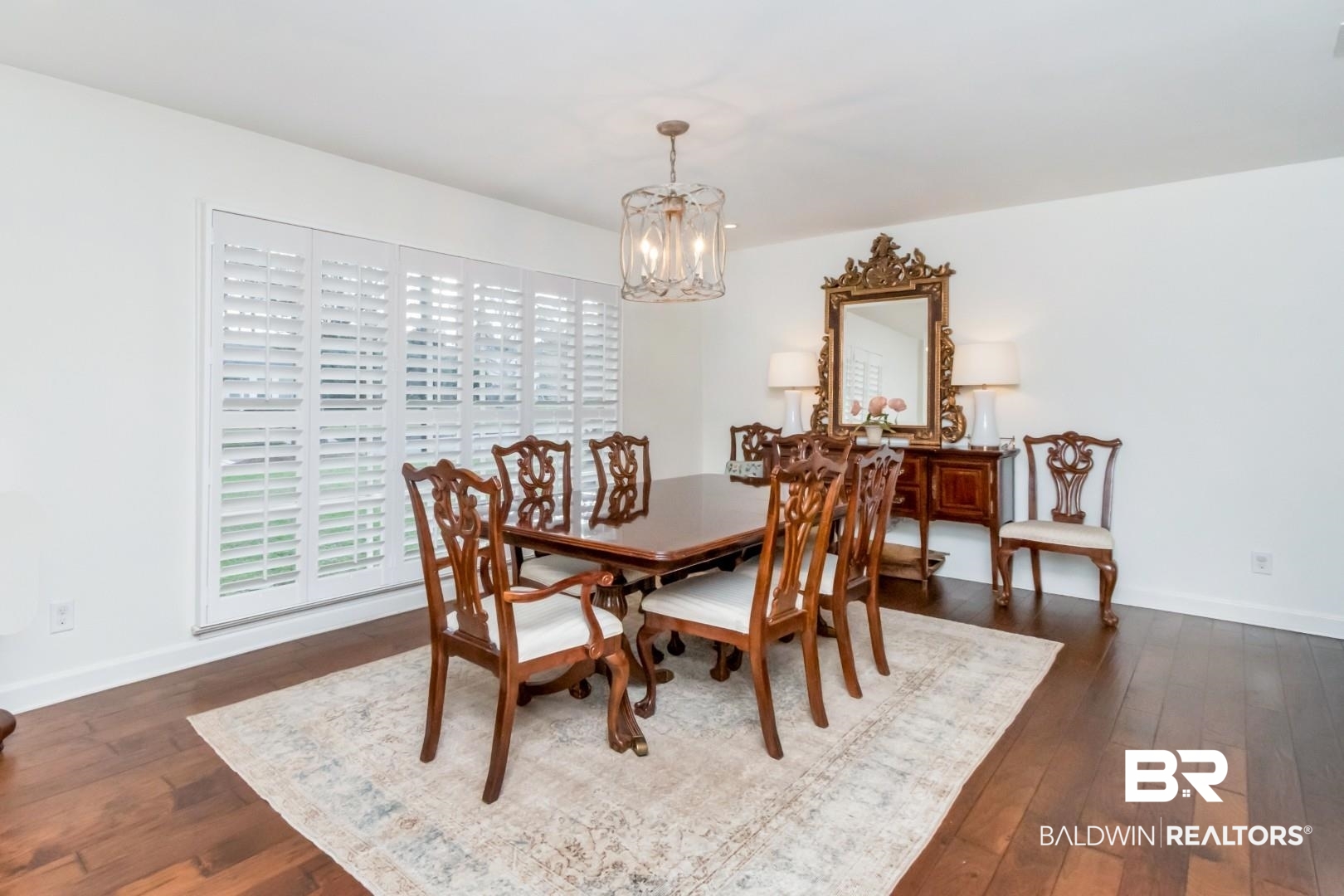 154 Fenwick Road Mobile, AL 36608 - Photo 9 of 48 Dining space featuring dark wood-style flooring and a chandelier