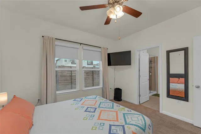 a bed sitting in a room next to a window