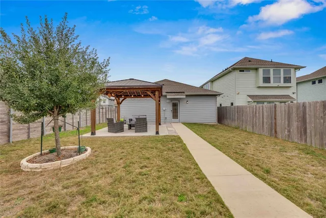 a house with palm tree in front of it