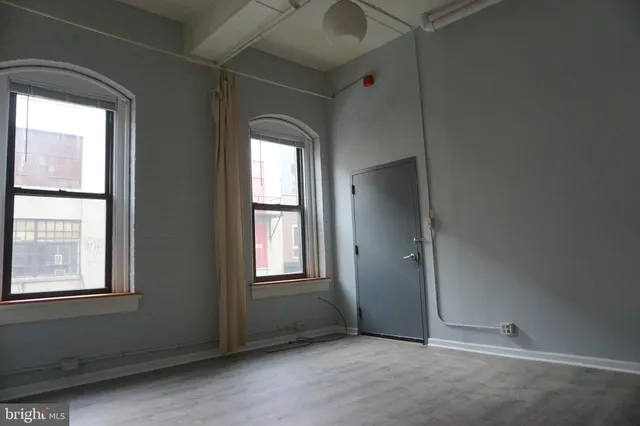 an empty room with windows