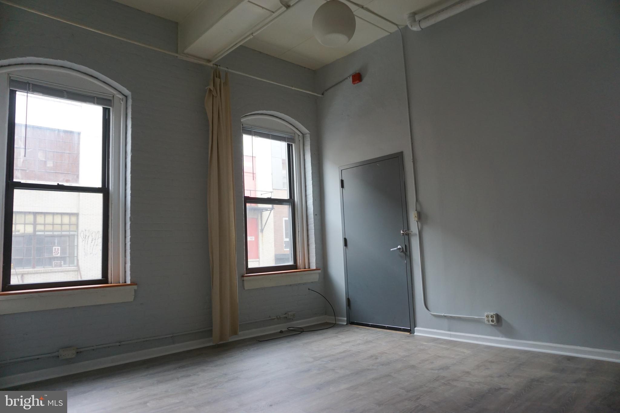 an empty room with windows