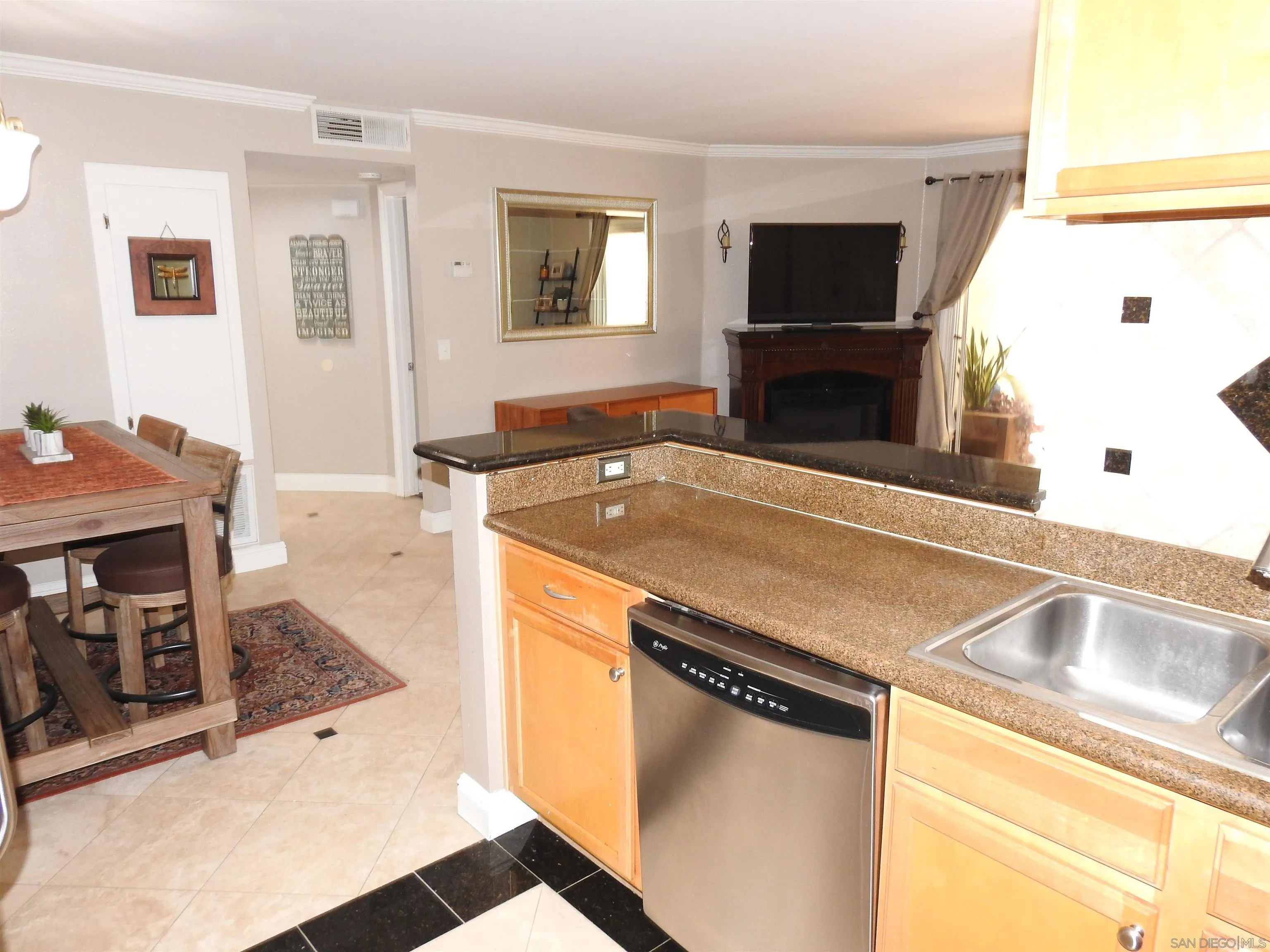 3515 Grove Street, Unit 108 Lemon Grove, CA 91945 - Photo 15 of 58 a kitchen with a sink stove and microwave