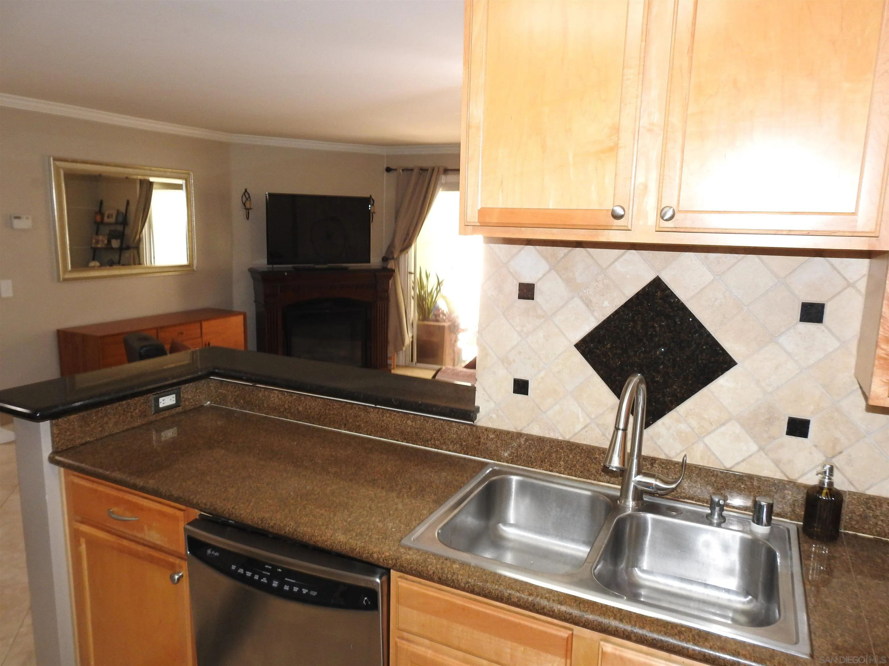 3515 Grove Street, Unit 108 Lemon Grove, CA 91945 - Photo 16 of 58 a close view of kitchen sink microwave and refrigerator