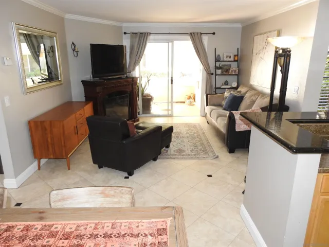 a living room with furniture and chandelier