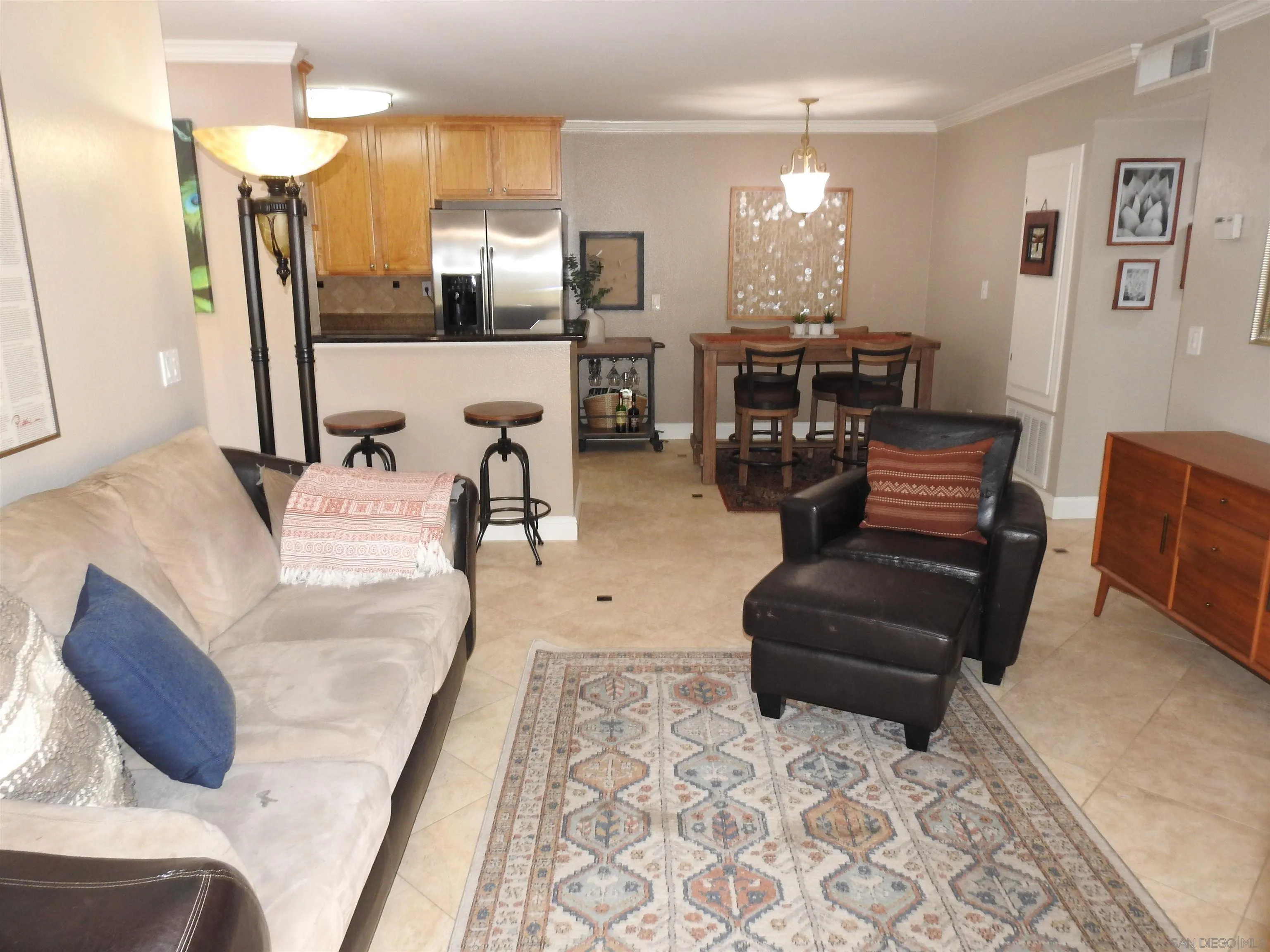 3515 Grove Street, Unit 108 Lemon Grove, CA 91945 - Photo 21 of 58 a living room with furniture and chandelier