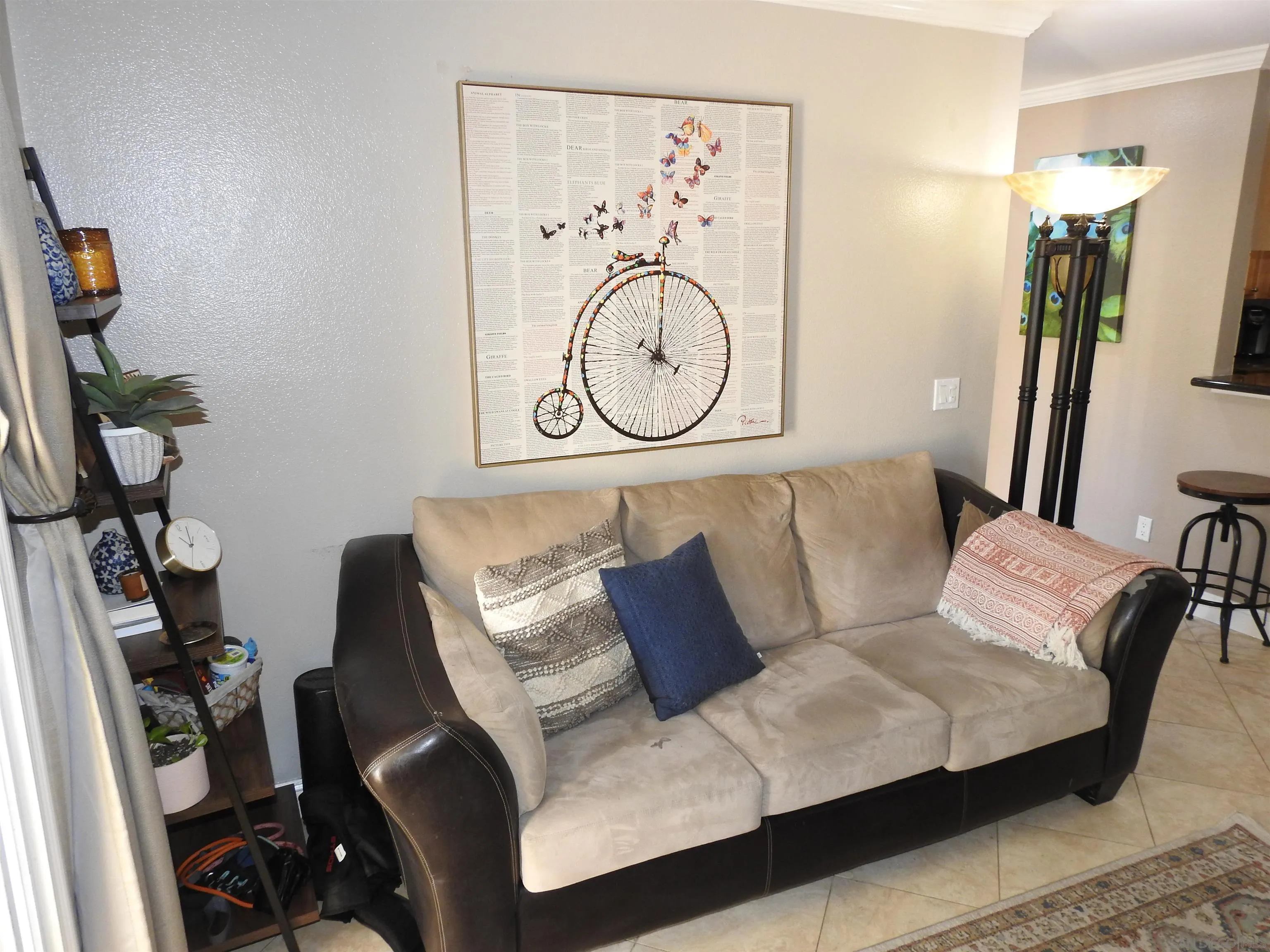 3515 Grove Street, Unit 108 Lemon Grove, CA 91945 - Photo 22 of 58 a living room with furniture a flat screen tv and a wall painting