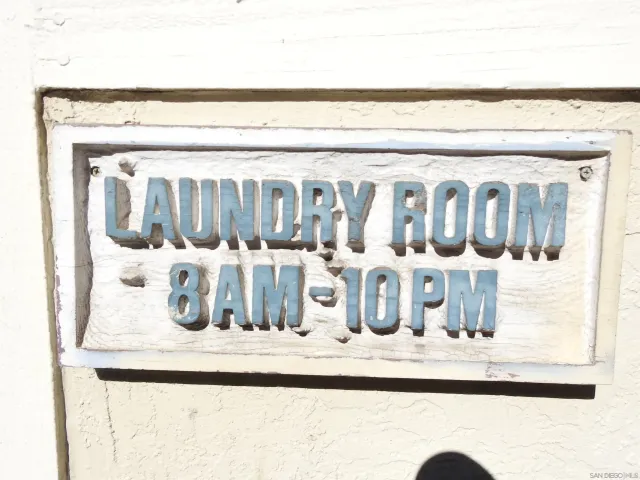 a outdoor space with a fountain and large trees