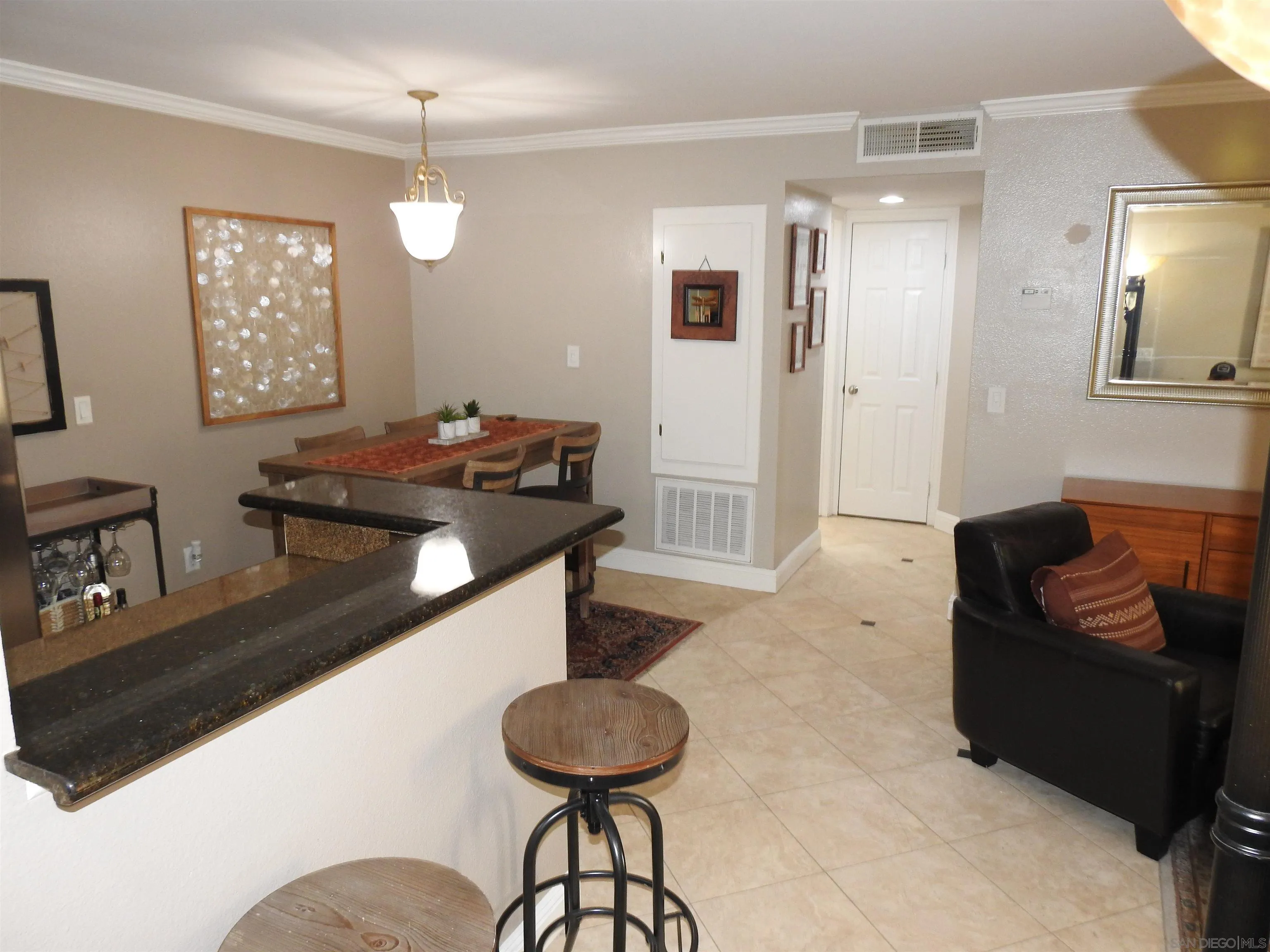 3515 Grove Street, Unit 108 Lemon Grove, CA 91945 - Photo 10 of 58 a living room with furniture and a dining table