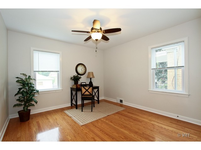 2250 Northgate Avenue North Riverside, IL 60546 - Photo 8 of 17 a view of a livingroom with furniture a chandelier fan and a window