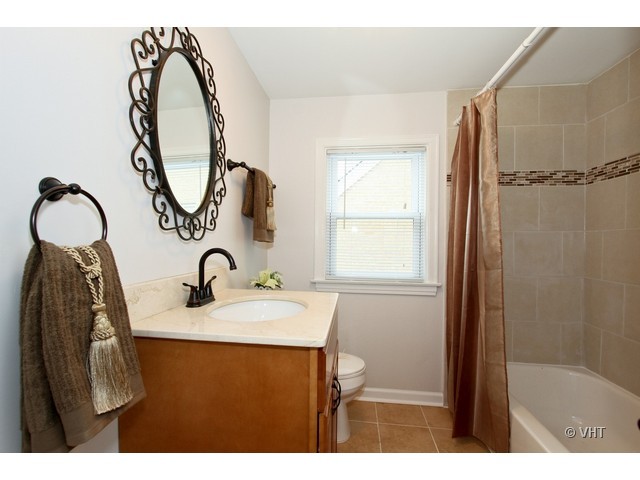 2250 Northgate Avenue North Riverside, IL 60546 - Photo 9 of 17 a bathroom with a sink vanity and a mirror