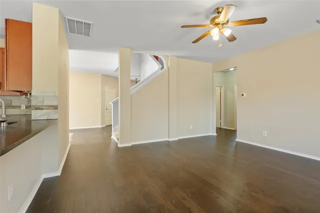 a view of a hallway with a kitchen