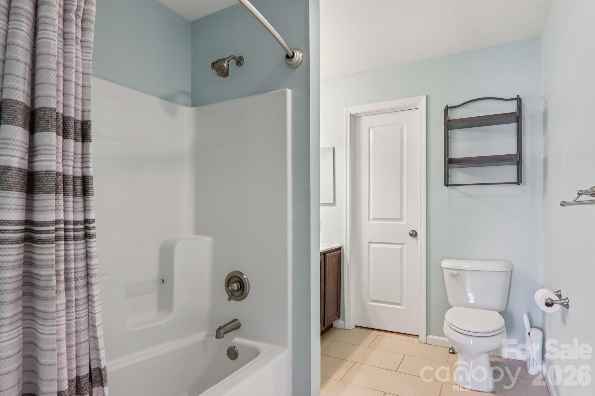 751 Hutch Mountain Road Fletcher, NC 28732 - Photo 22 of 48 a bathroom with a toilet and a shower