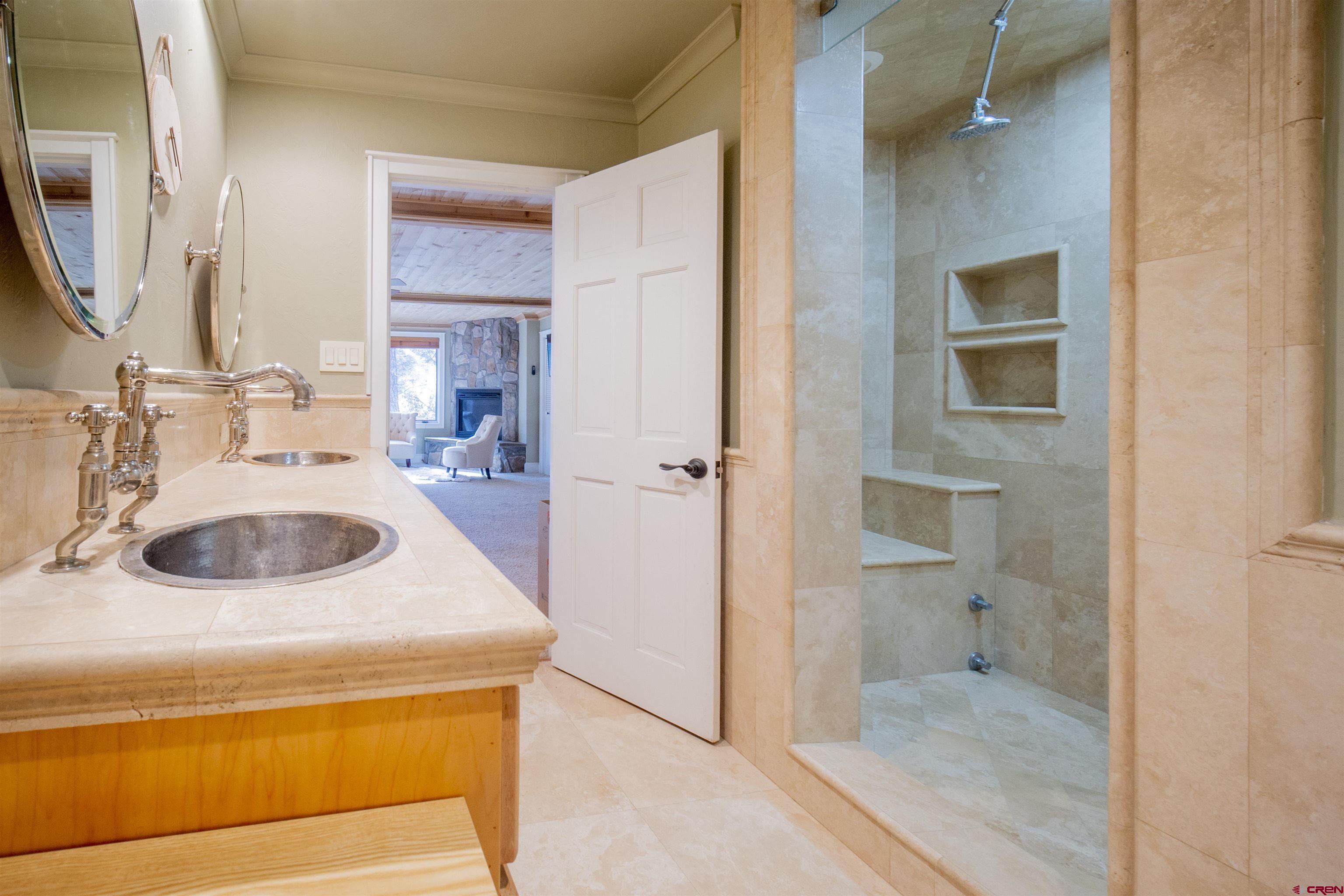 75 Rockwood Drive Durango, CO 81301 - Photo 19 of 24 a en suite bathroom with a sink toilet and shower