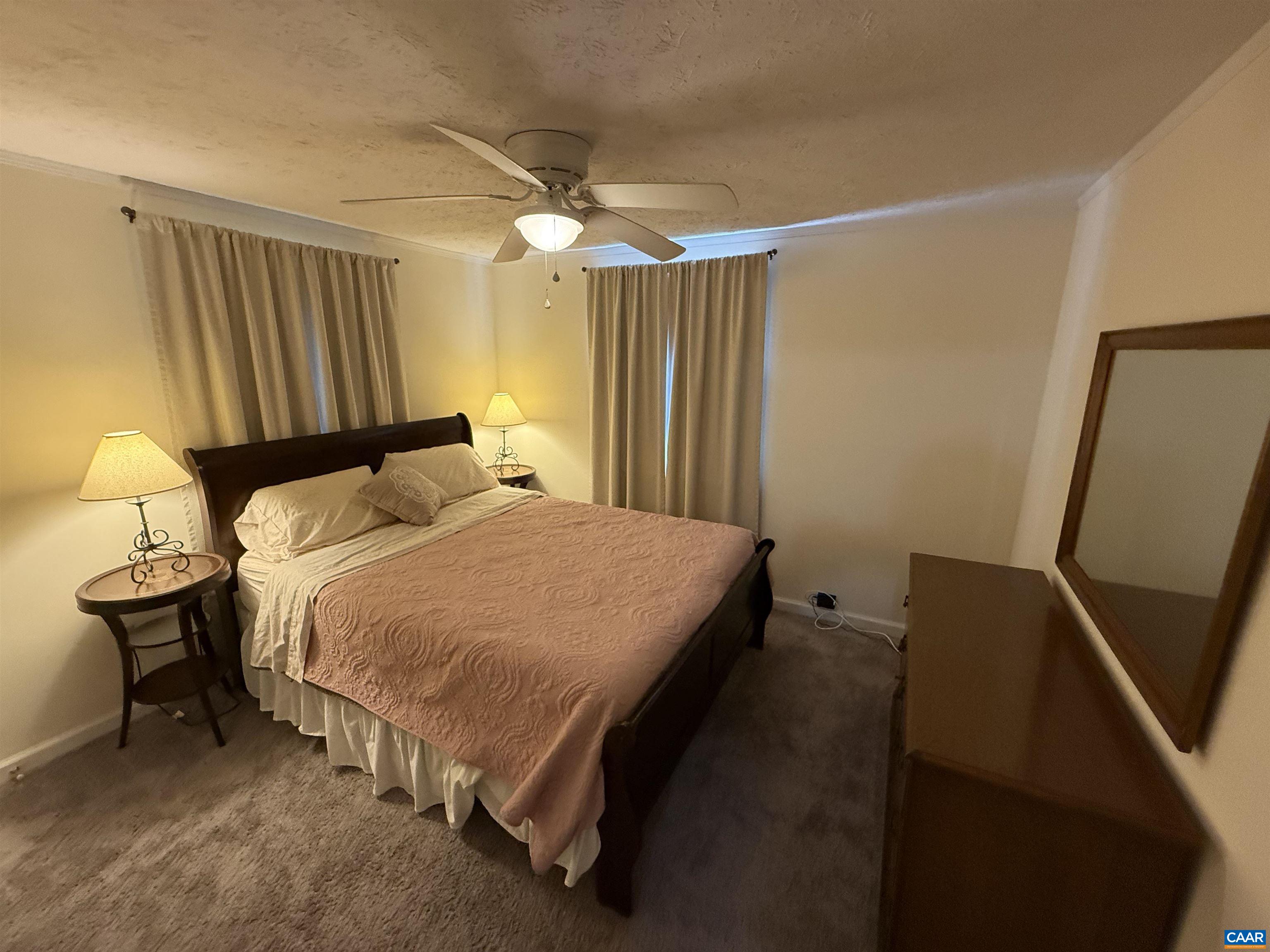 2002 Oliver Creek Road Troy, VA 22974 - Photo 19 of 38 a bed sitting in a bedroom next to a window
