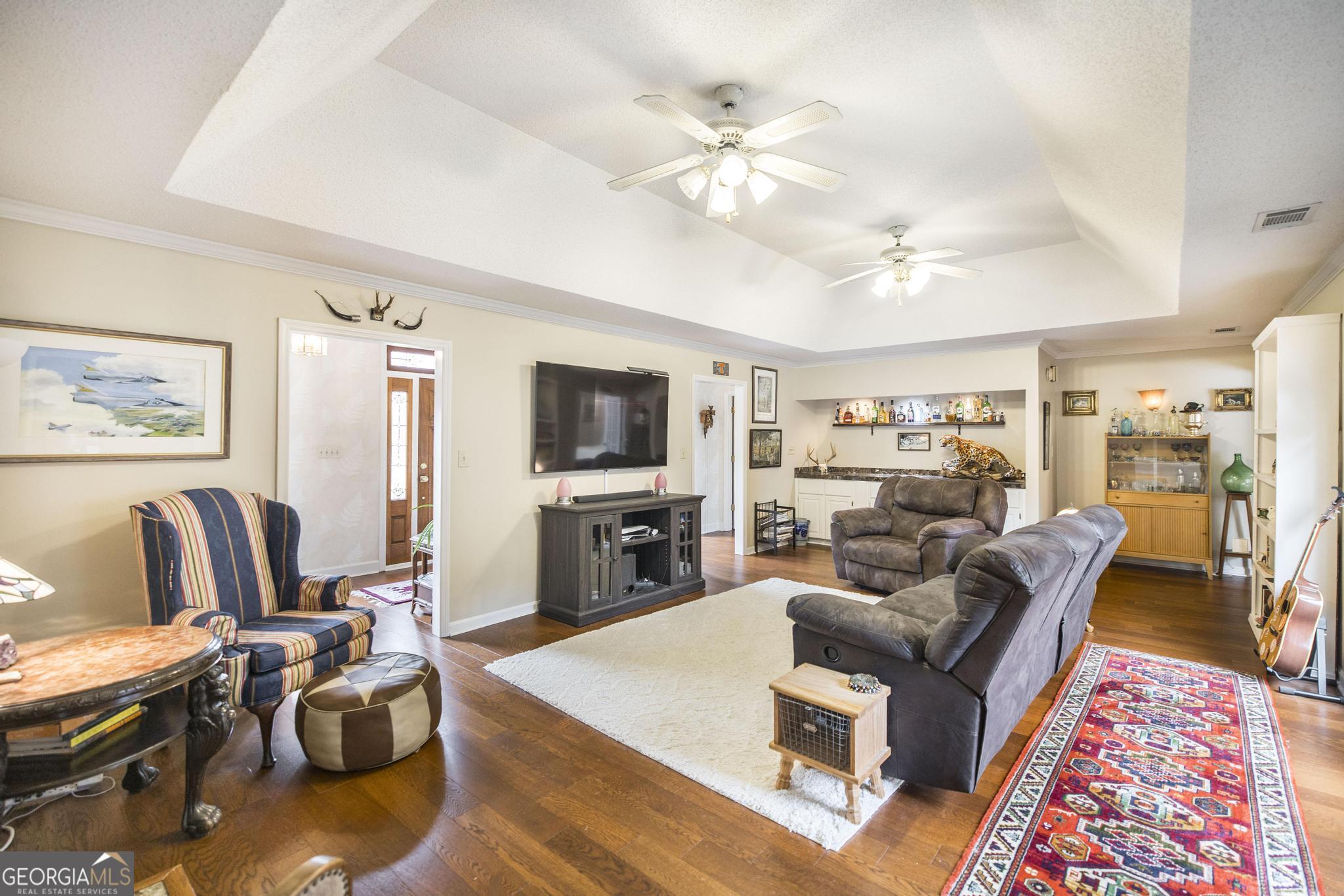 108 Bunkers Trail Warner Robins, GA 31088 - Photo 11 of 34 a living room with furniture and a flat screen tv