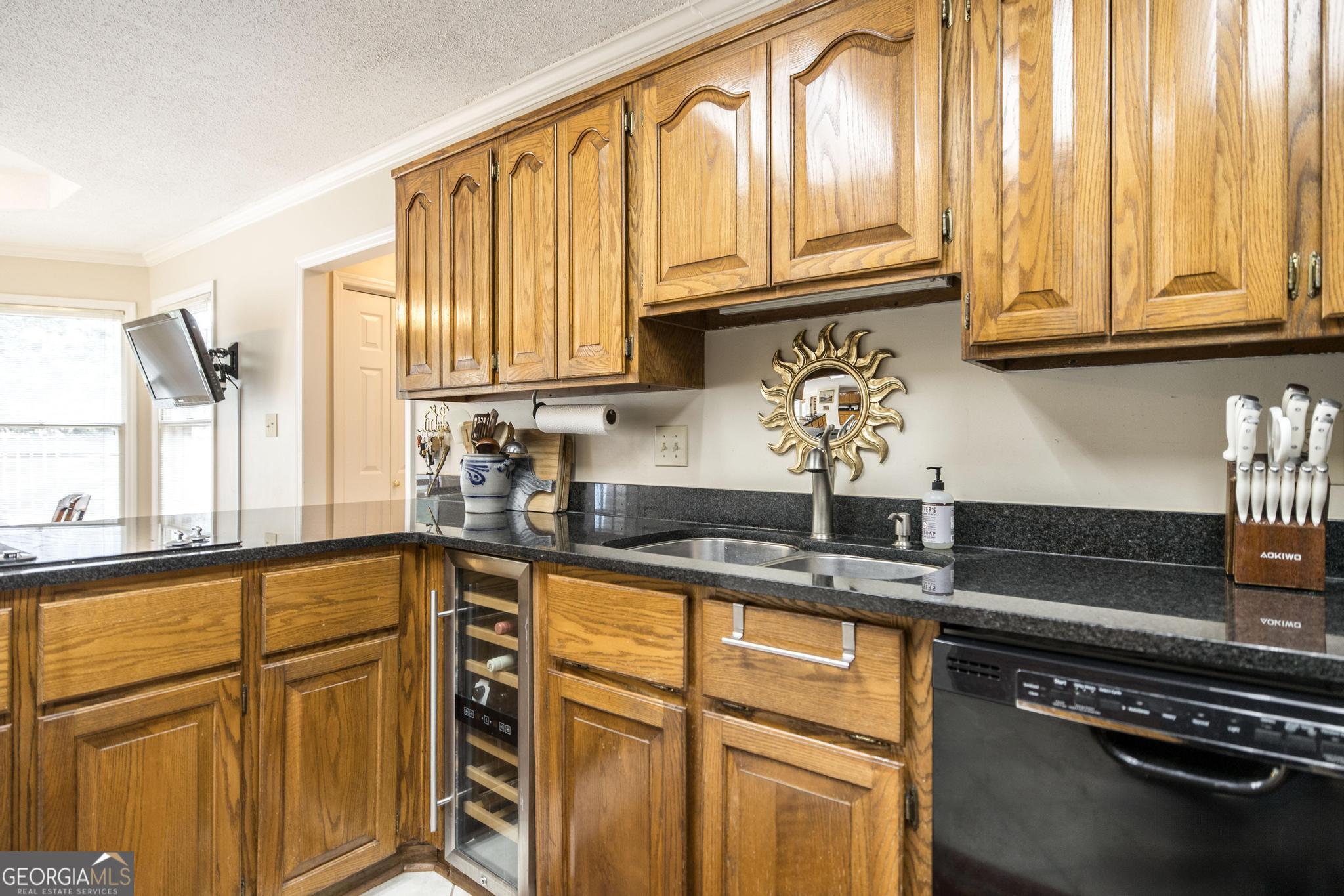 108 Bunkers Trail Warner Robins, GA 31088 - Photo 15 of 34 a kitchen with stainless steel appliances granite countertop a refrigerator and sink