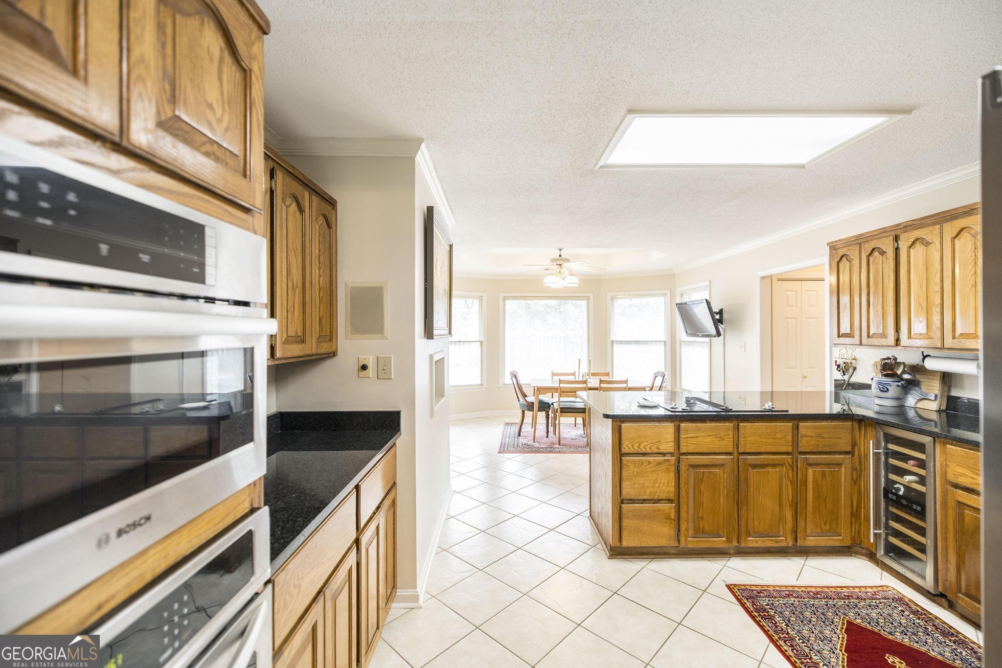 108 Bunkers Trail Warner Robins, GA 31088 - Photo 17 of 34 a kitchen with a stove a sink and cabinets