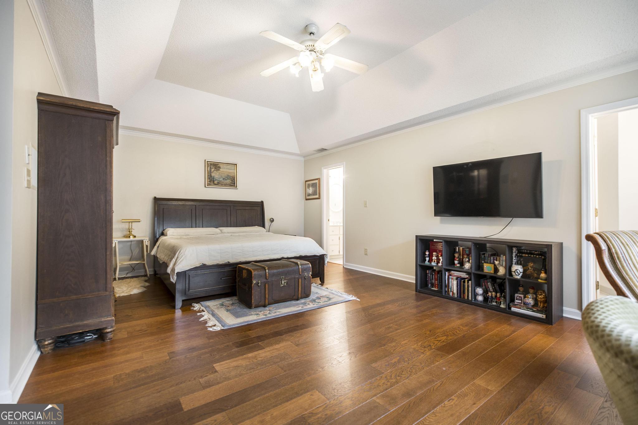 108 Bunkers Trail Warner Robins, GA 31088 - Photo 20 of 34 a bedroom with a bed and a flat screen tv