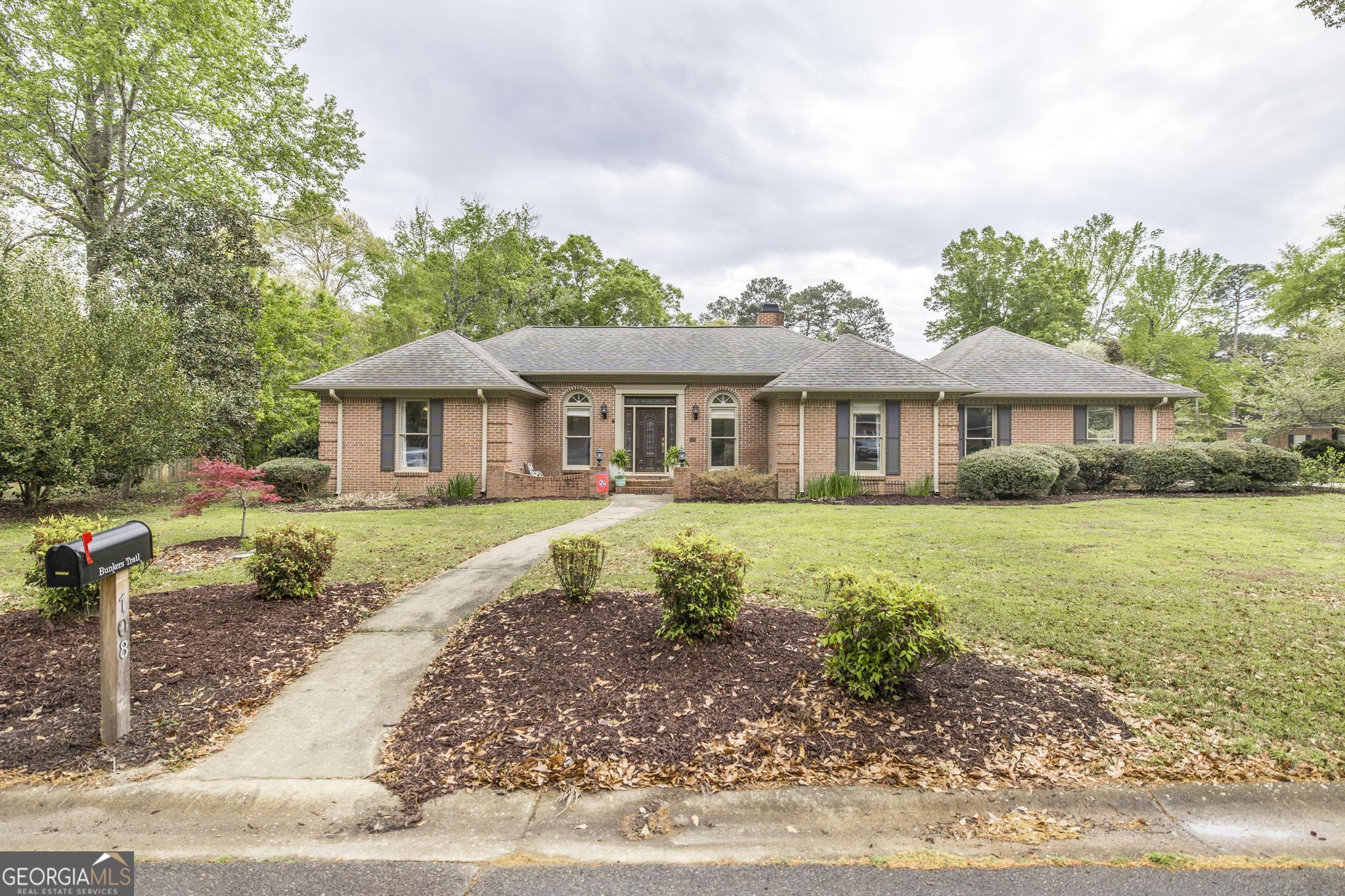 108 Bunkers Trail Warner Robins, GA 31088 - Photo 2 of 34 a front view of a house with a yard