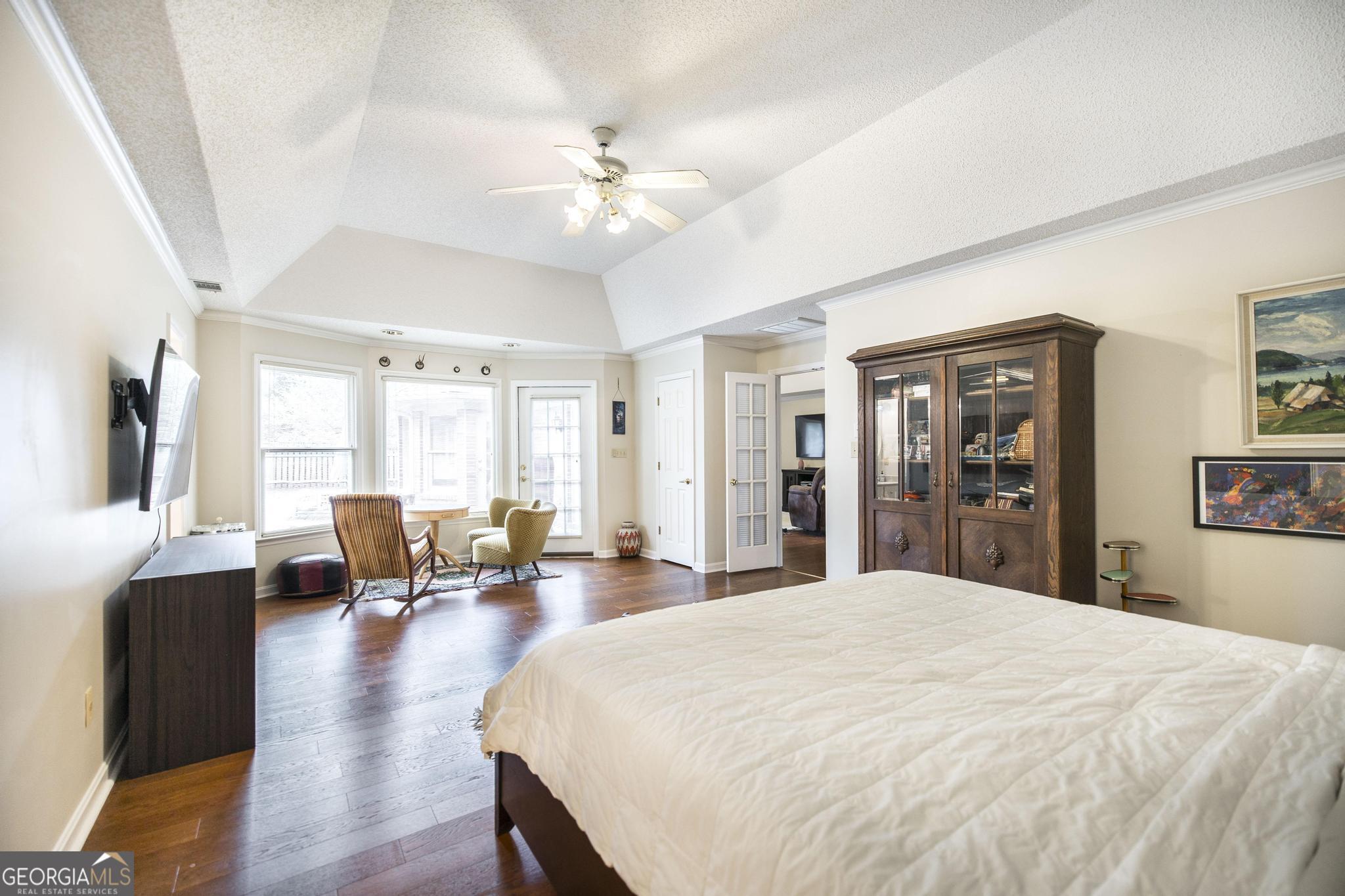108 Bunkers Trail Warner Robins, GA 31088 - Photo 22 of 34 a large bedroom with wooden floor and large window