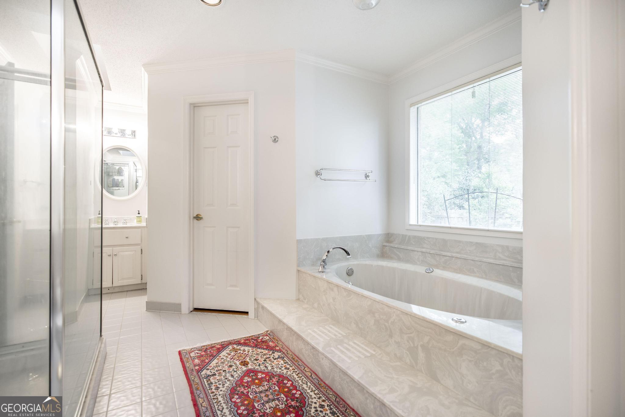 108 Bunkers Trail Warner Robins, GA 31088 - Photo 24 of 34 a spacious bathroom with a bathtub and a shower