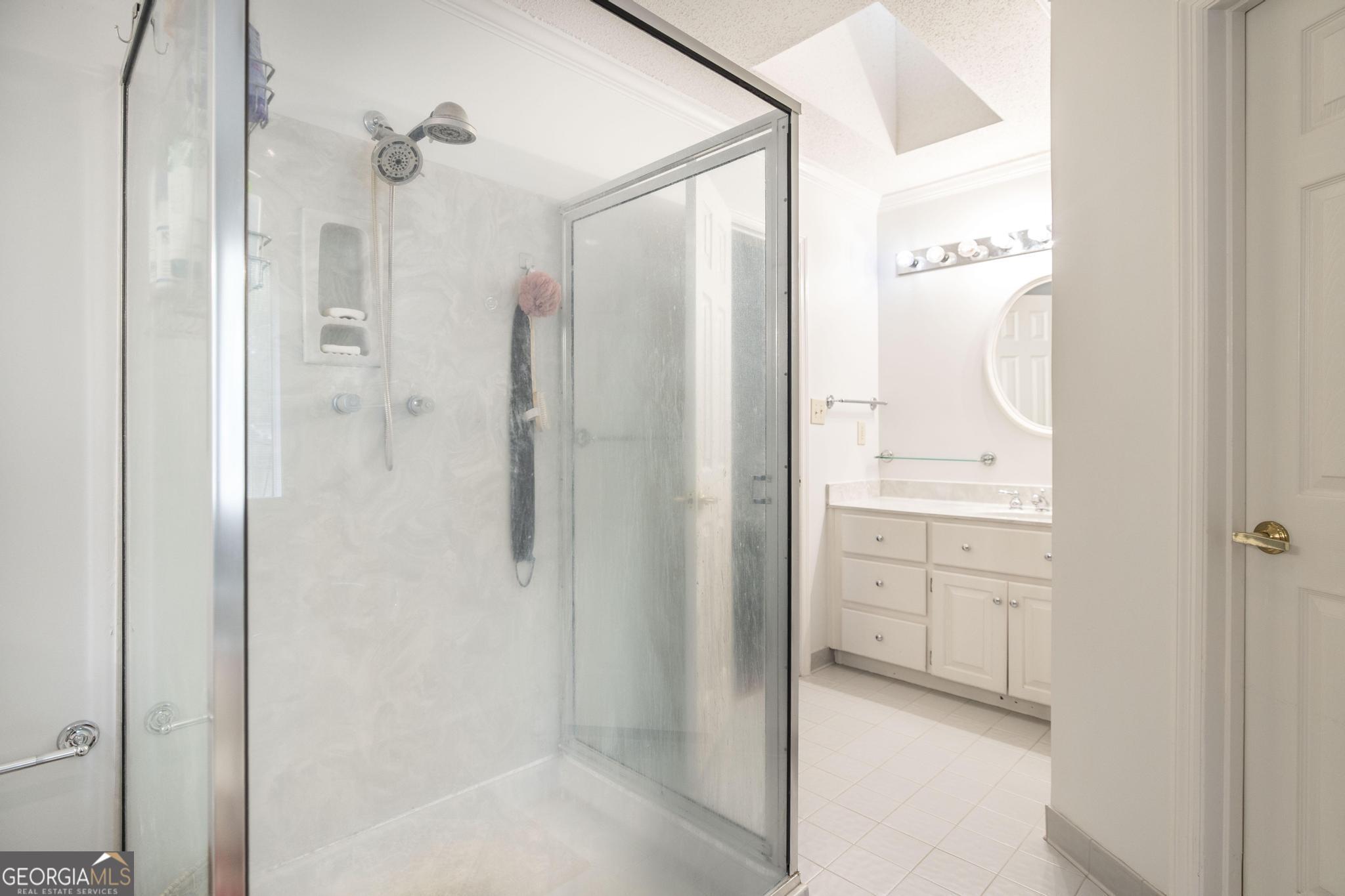 108 Bunkers Trail Warner Robins, GA 31088 - Photo 25 of 34 a bathroom with a shower and a mirror