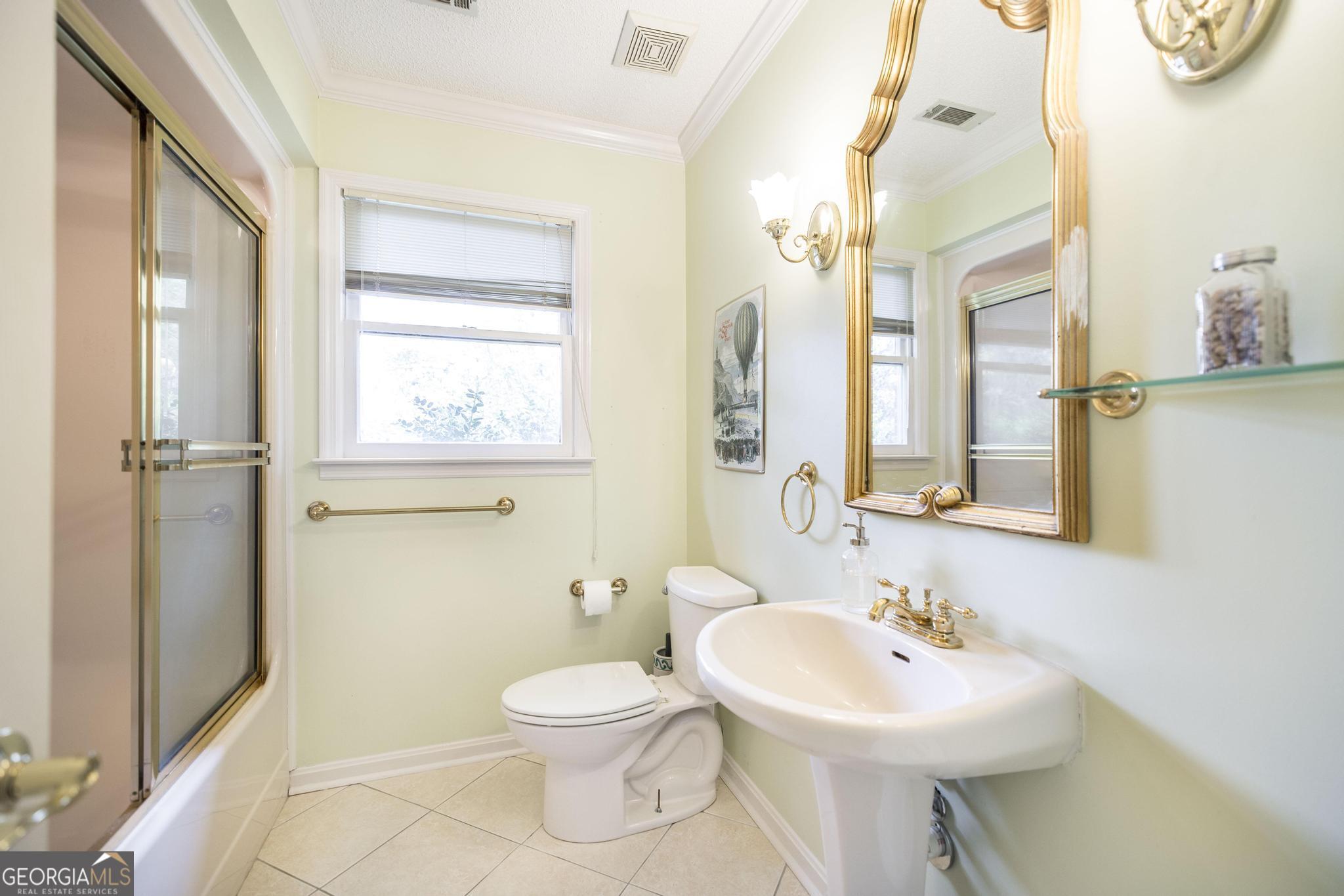 108 Bunkers Trail Warner Robins, GA 31088 - Photo 28 of 34 a bathroom with a sink a toilet and a mirror