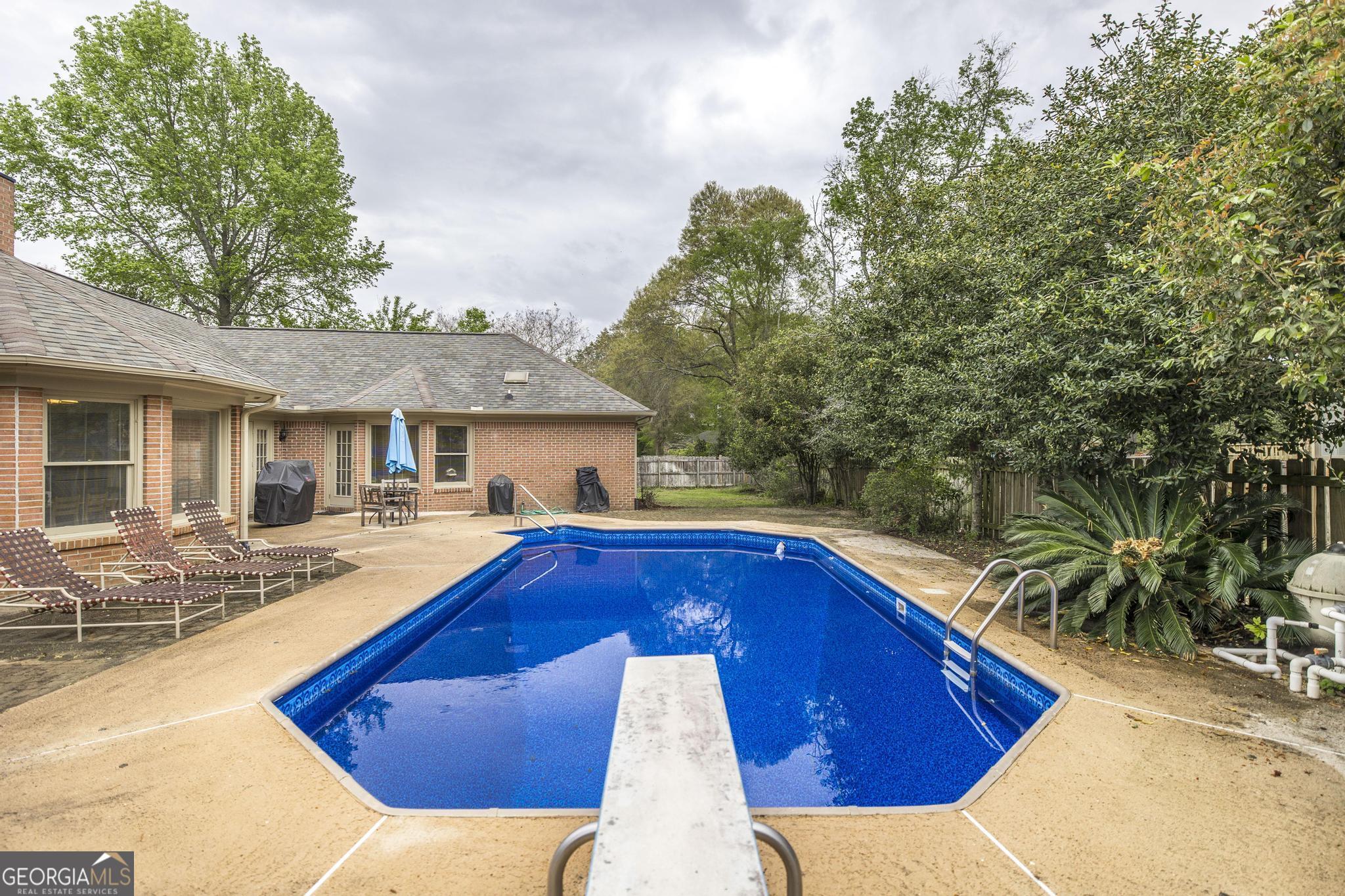 108 Bunkers Trail Warner Robins, GA 31088 - Photo 32 of 34 a view of house with swimming pool outdoor seating
