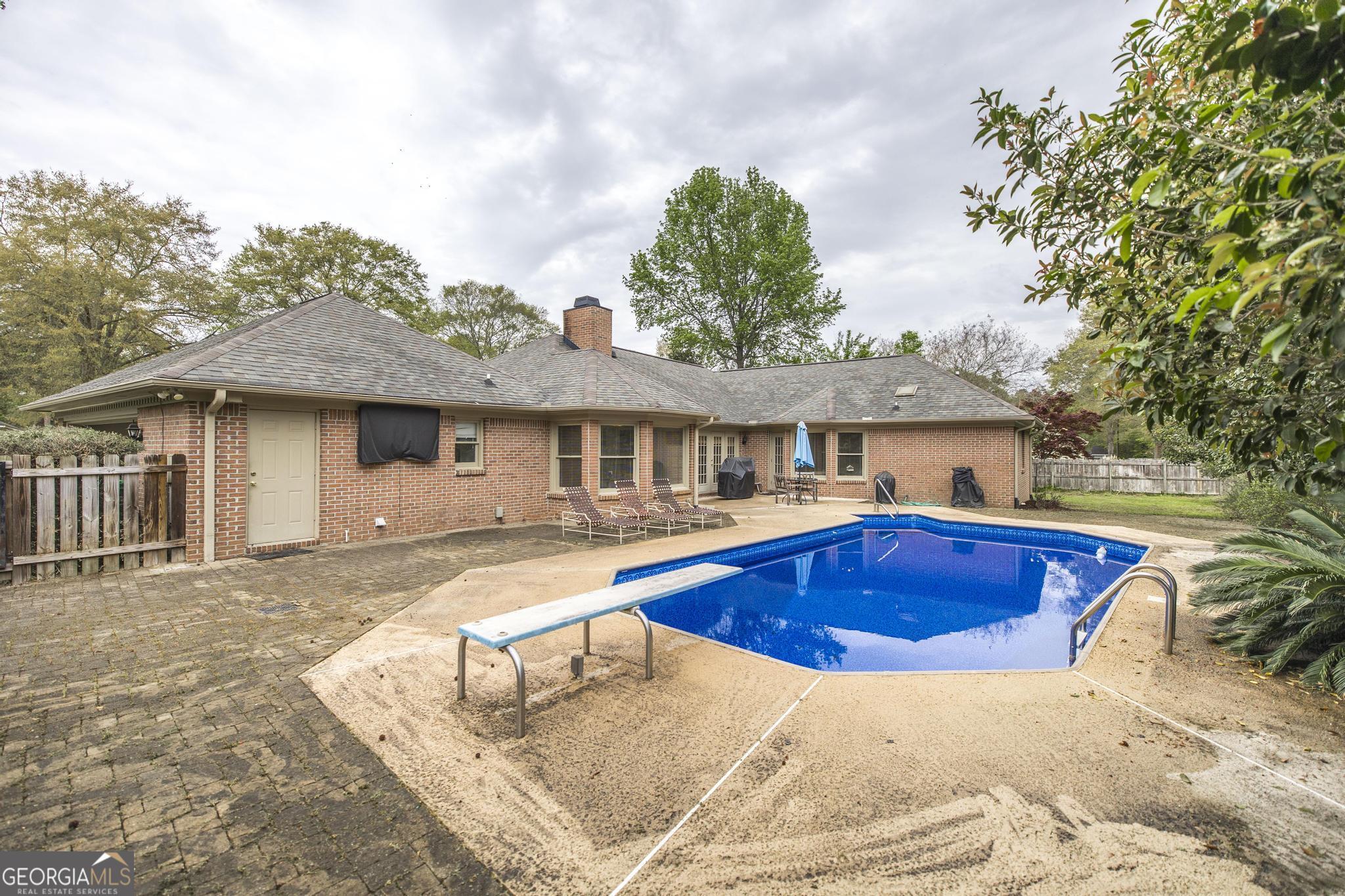108 Bunkers Trail Warner Robins, GA 31088 - Photo 33 of 34 a front view of house with yard swimming pool and basket ball court
