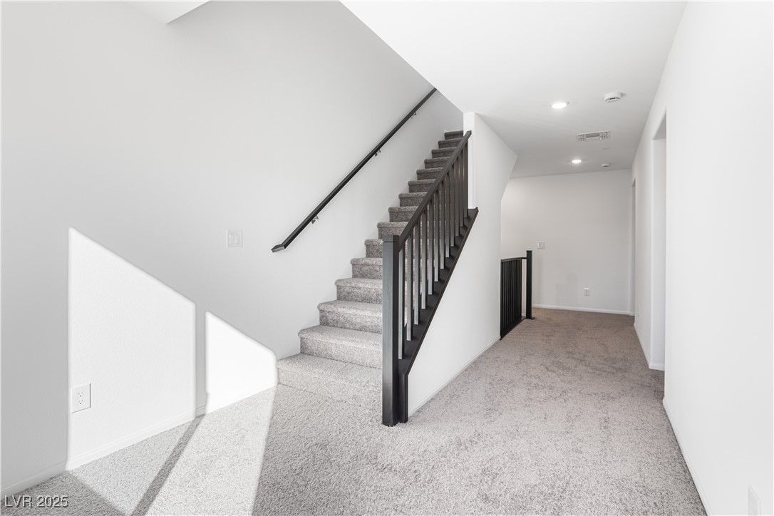 5662 Spring Trellis Street Las Vegas, NV 89113 - Photo 11 of 21 Stairs featuring recessed lighting and carpet