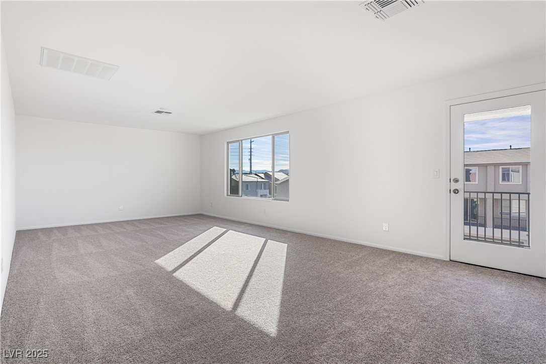 5662 Spring Trellis Street Las Vegas, NV 89113 - Photo 14 of 21 Empty room featuring carpet and baseboards