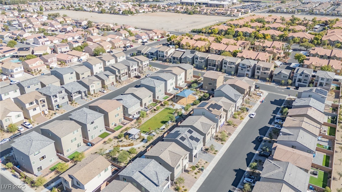 5662 Spring Trellis Street Las Vegas, NV 89113 - Photo 17 of 21 Aerial perspective of suburban area