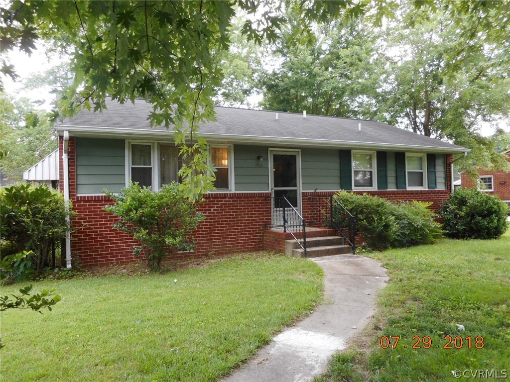 4707 East Caryhurst Road Richmond, VA 23223 - Photo 1 of 11 a front view of house with yard and green space