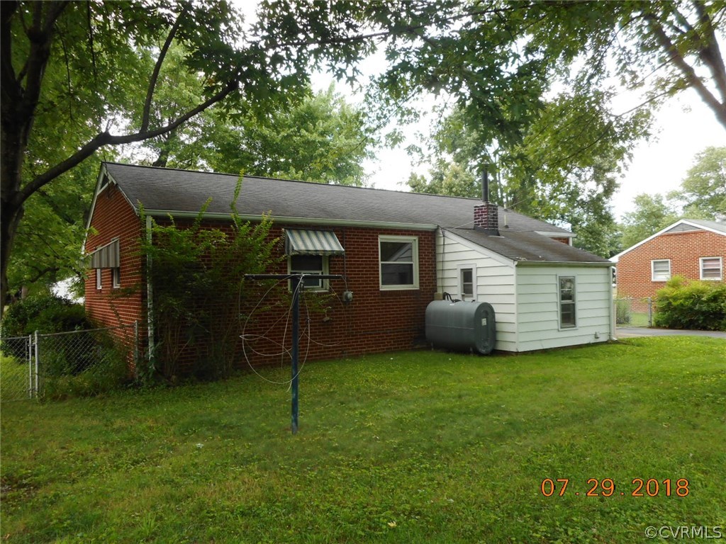 4707 East Caryhurst Road Richmond, VA 23223 - Photo 2 of 11 a view of a house with backyard and a tree