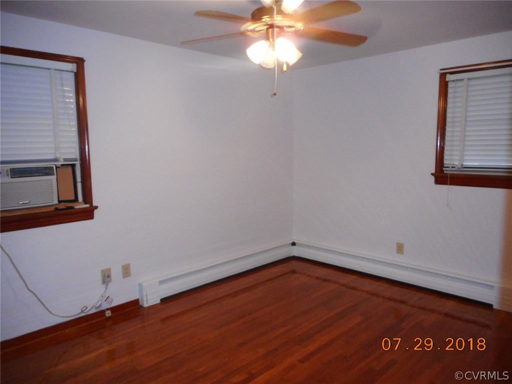 4707 East Caryhurst Road Richmond, VA 23223 - Photo 7 of 11 an empty room with a window and ceiling fan
