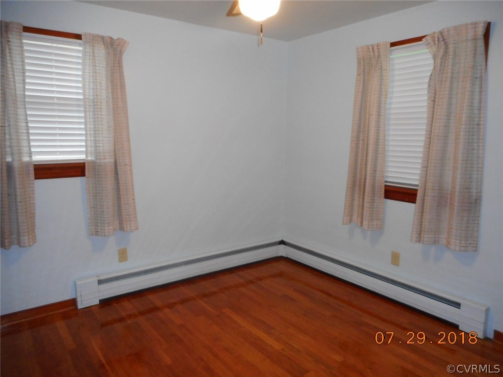 4707 East Caryhurst Road Richmond, VA 23223 - Photo 8 of 11 a view of a room with wooden floor and fan