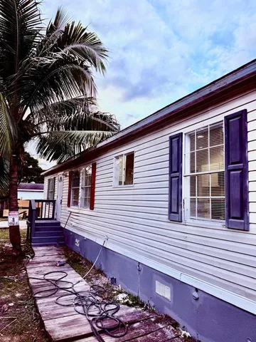 a view of a swimming pool and a yard