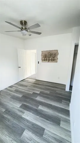 a view of kitchen with kitchen island microwave and sink