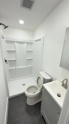 a bathroom with a sink and a toilet
